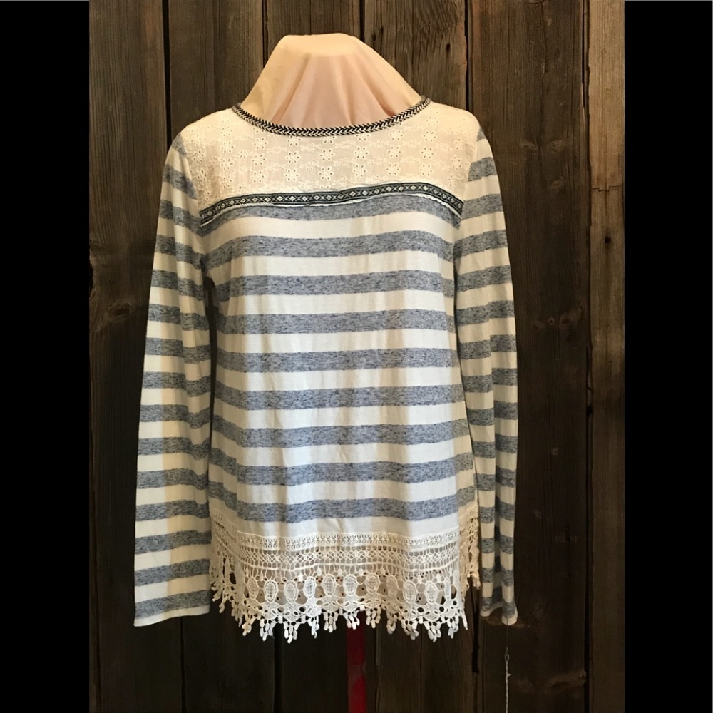 Long sleeved, blue and white striped.